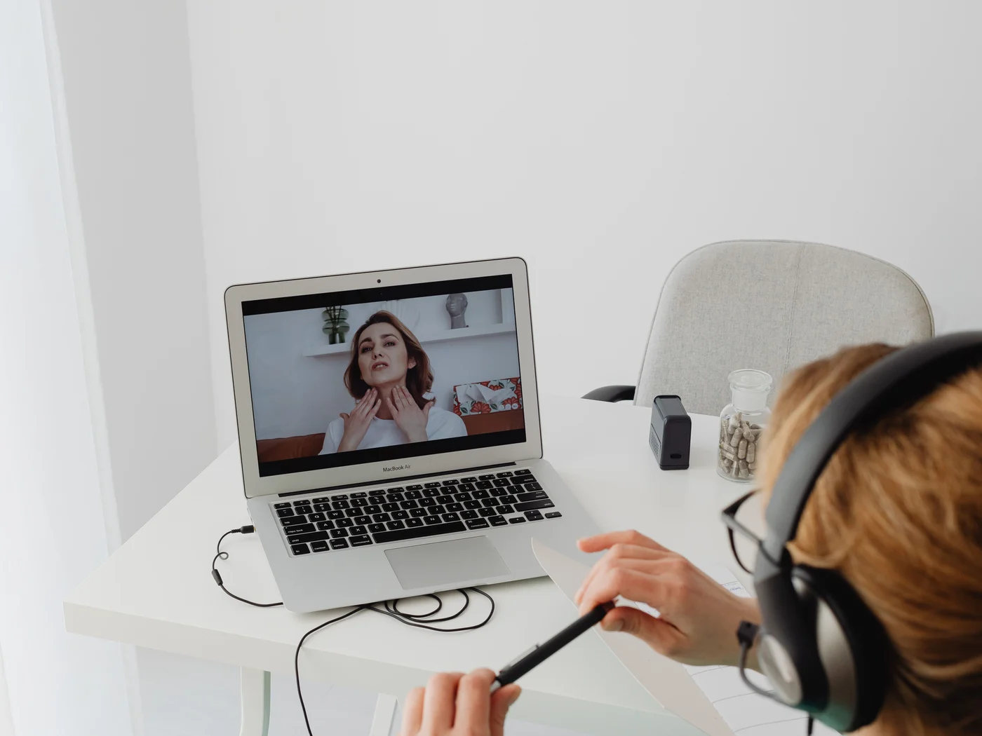 Patient attending a telemedicine consultation on a laptop