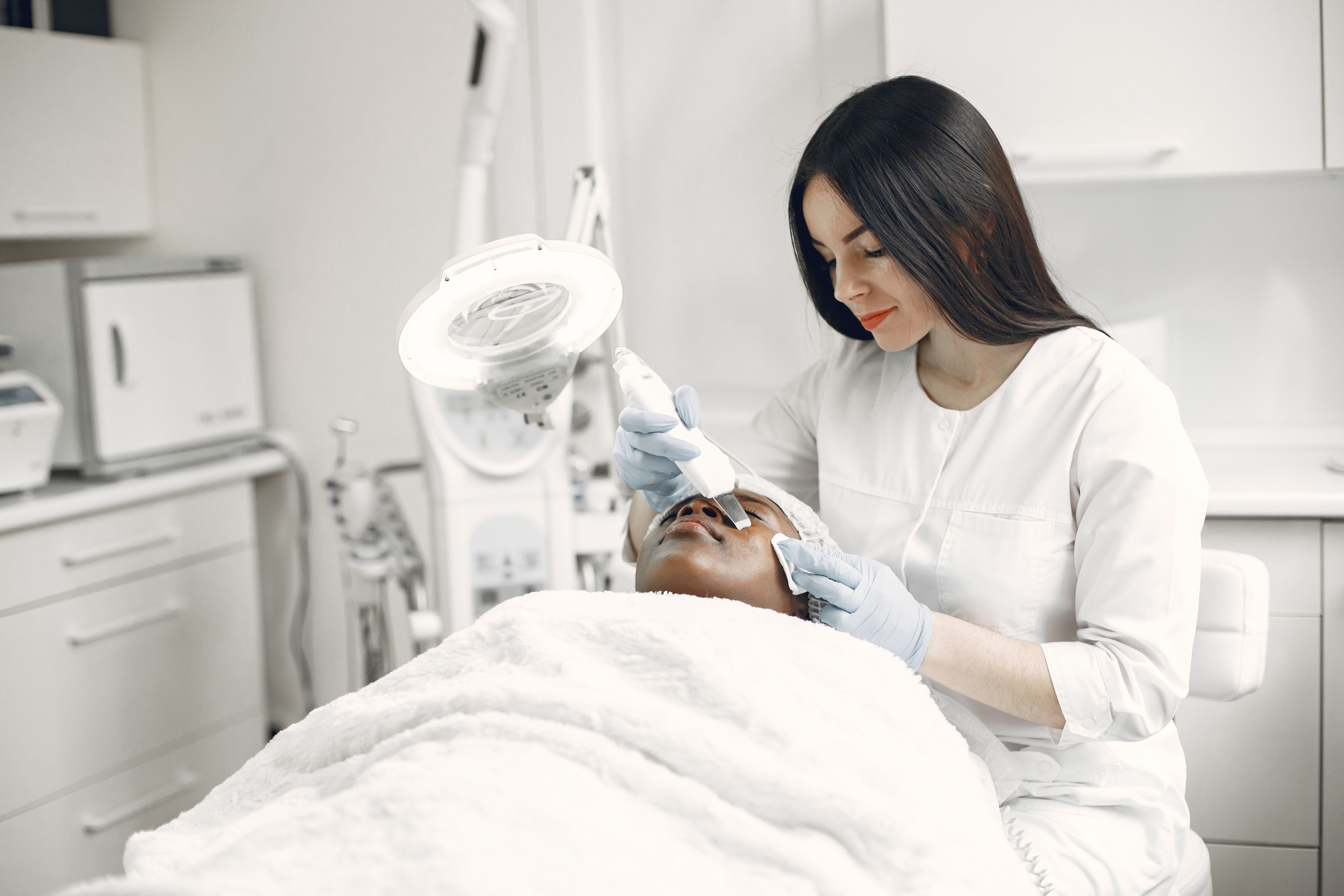 Woman receiving a facial treatment