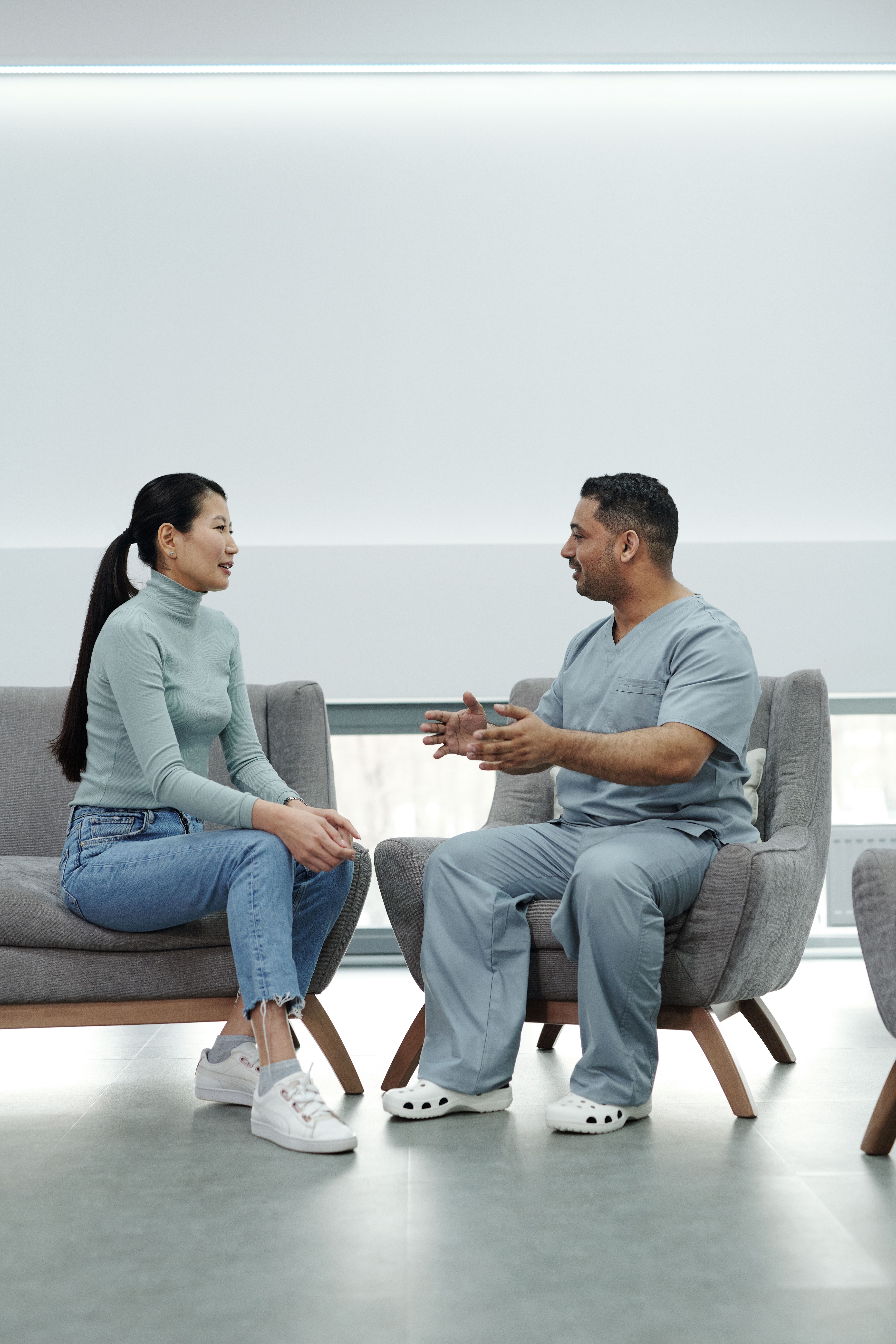 Doctor talking with an adult patient