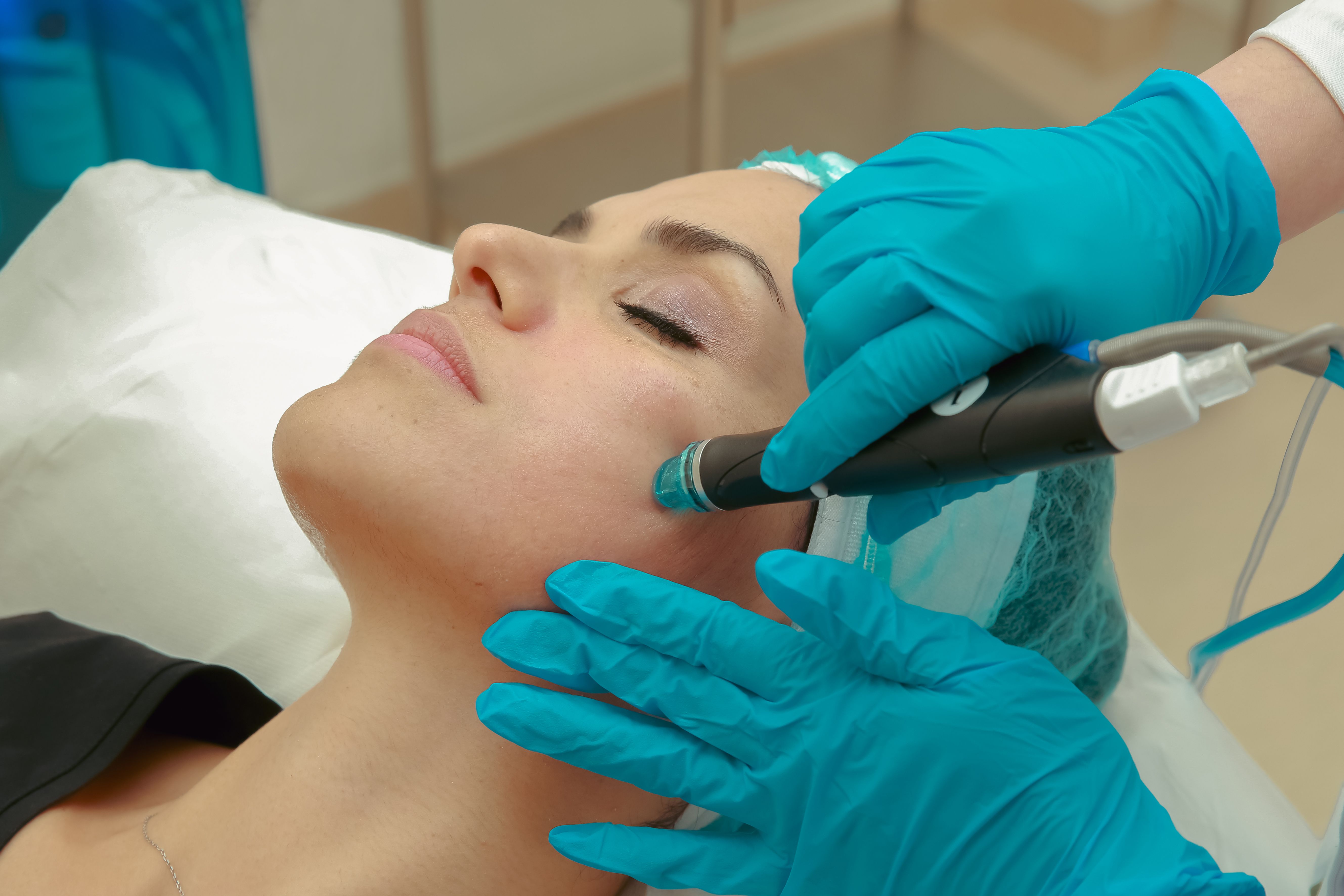 Woman receiving a facial treatment