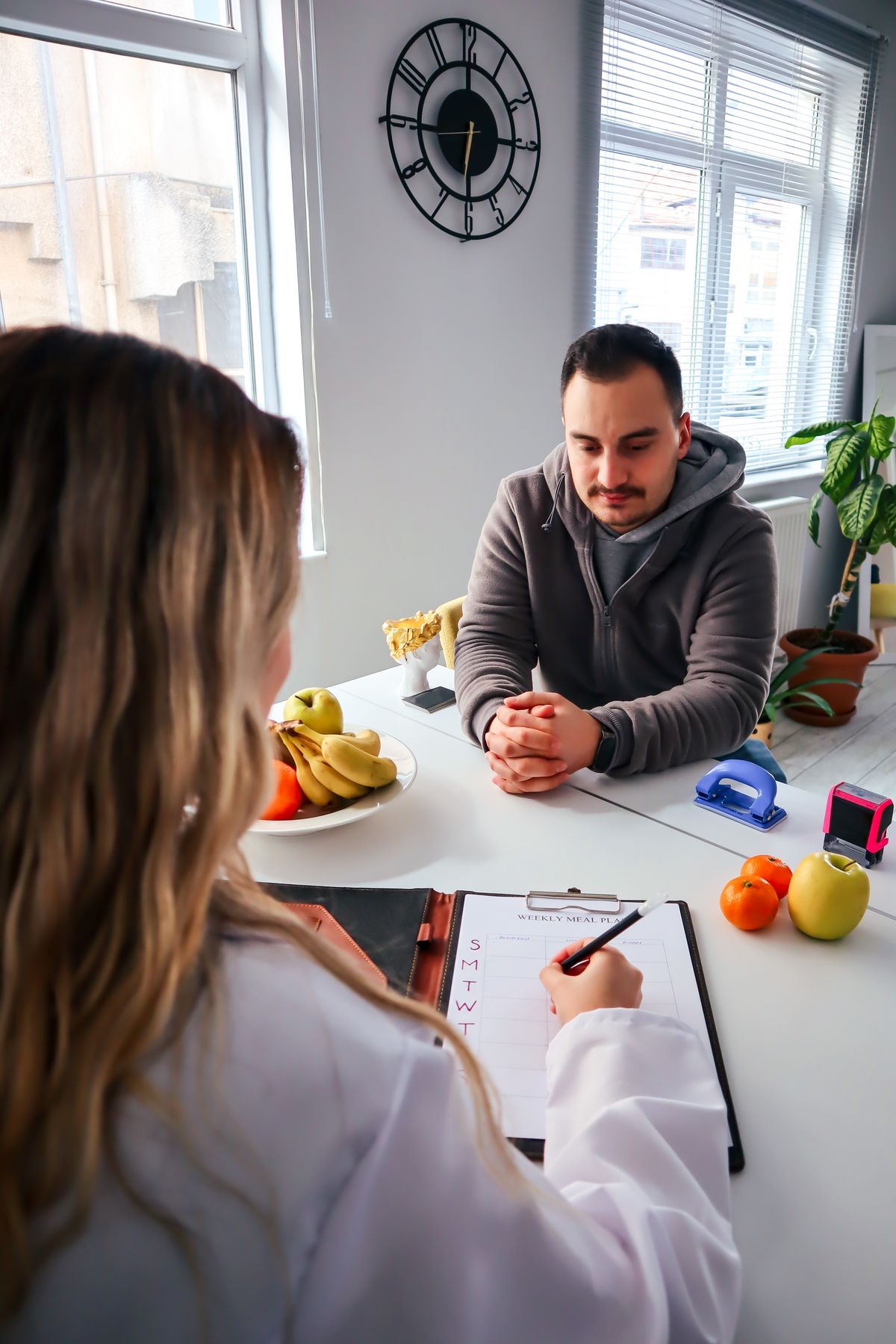 Patient meeting with a clinician for nutrition and weight-management guidance